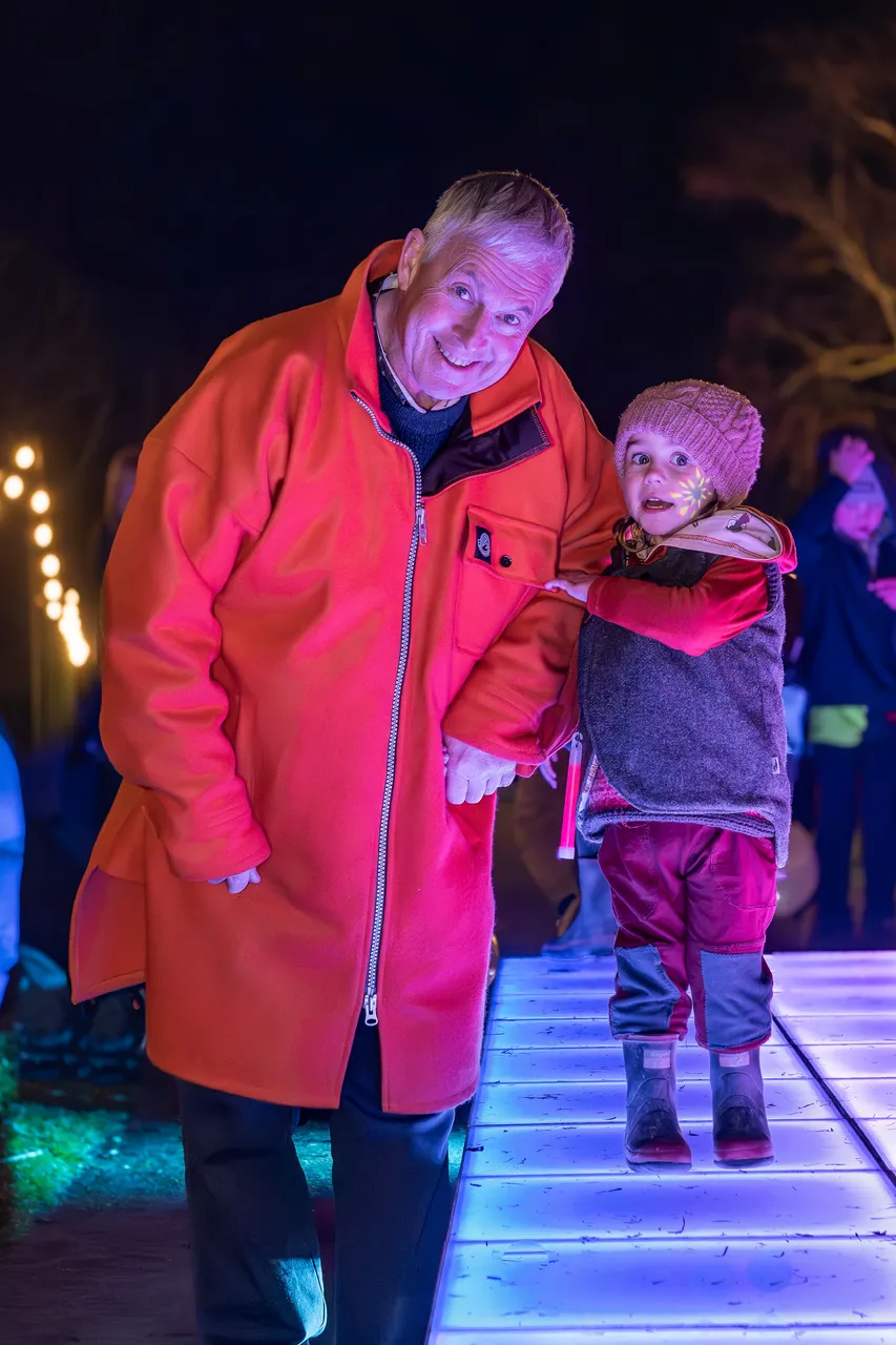 Child and man using light up walkway