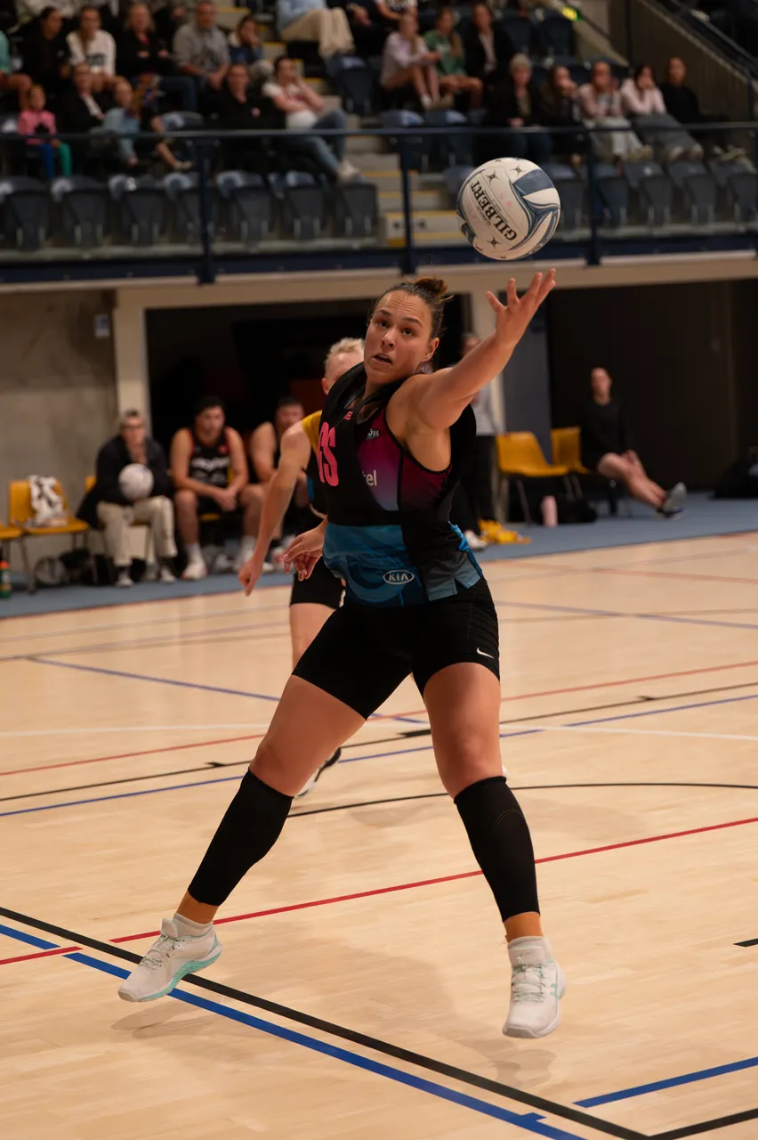 Steel Player catching a netball