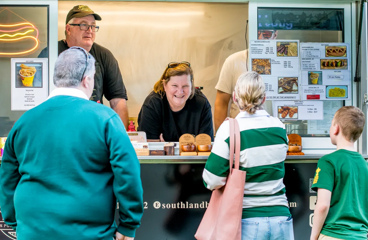 People buying food from a food truck