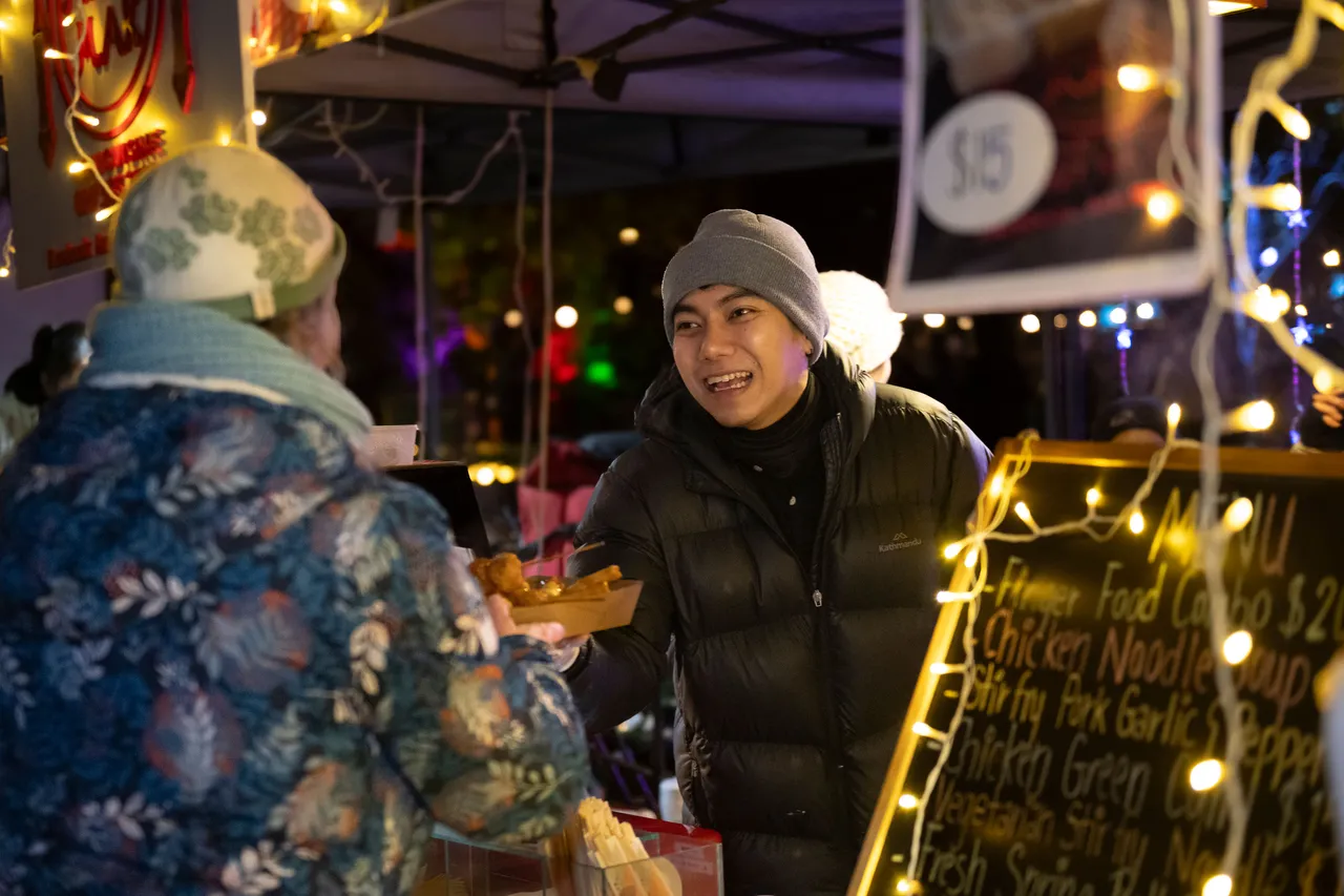 Man serving food to customer