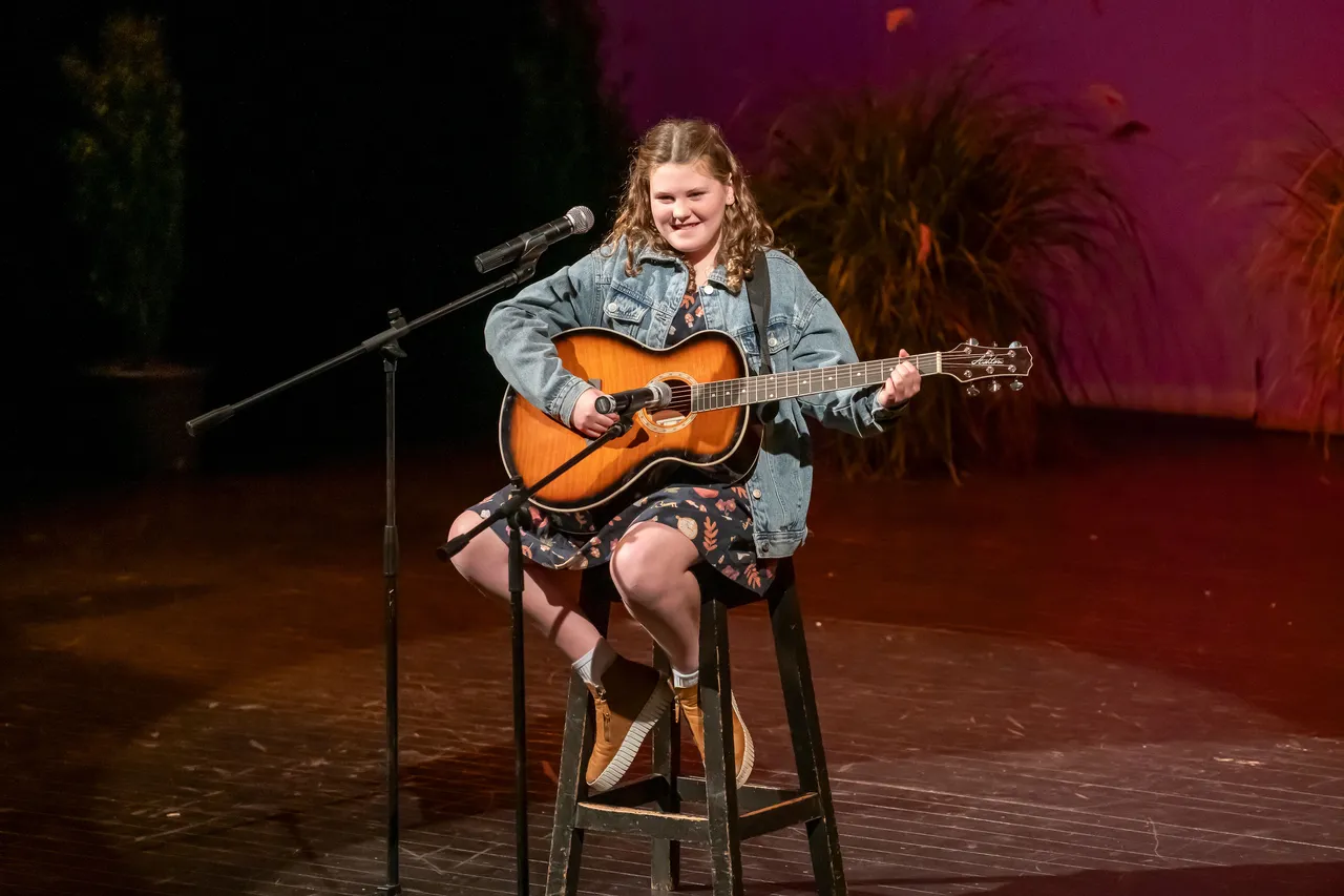 girl playing guitar