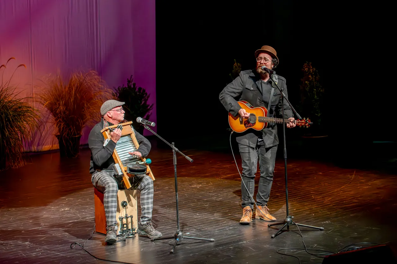 Father & Son performing on stage at St James Theatre