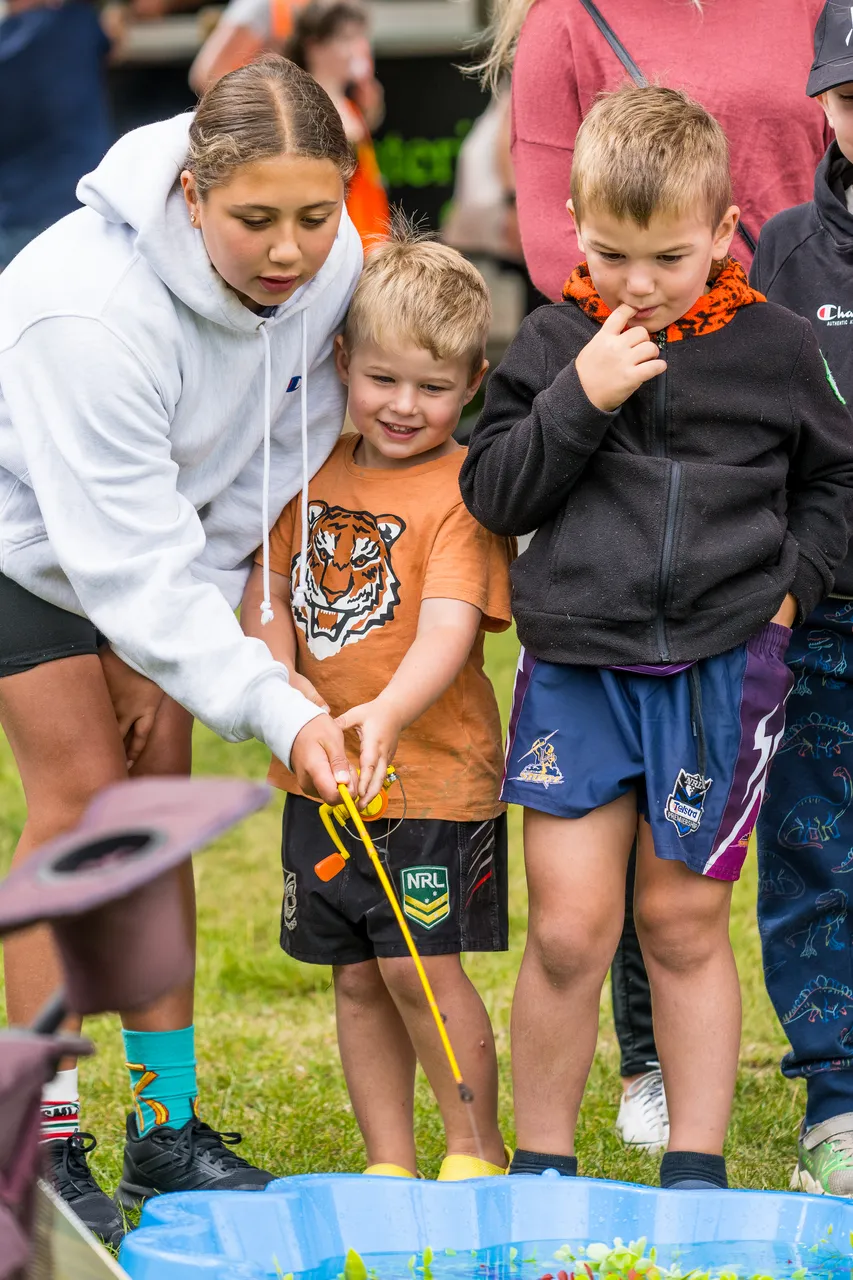 Children playing a fishing game
