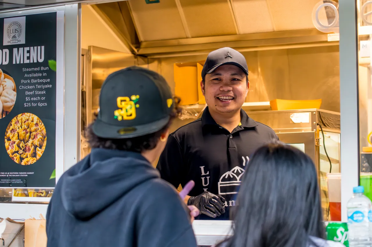 People ordering food from a food truck