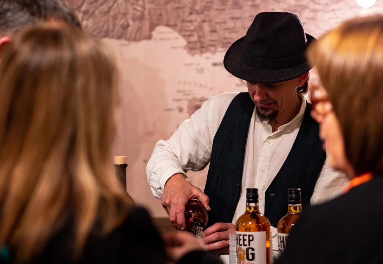 Man puring a drink