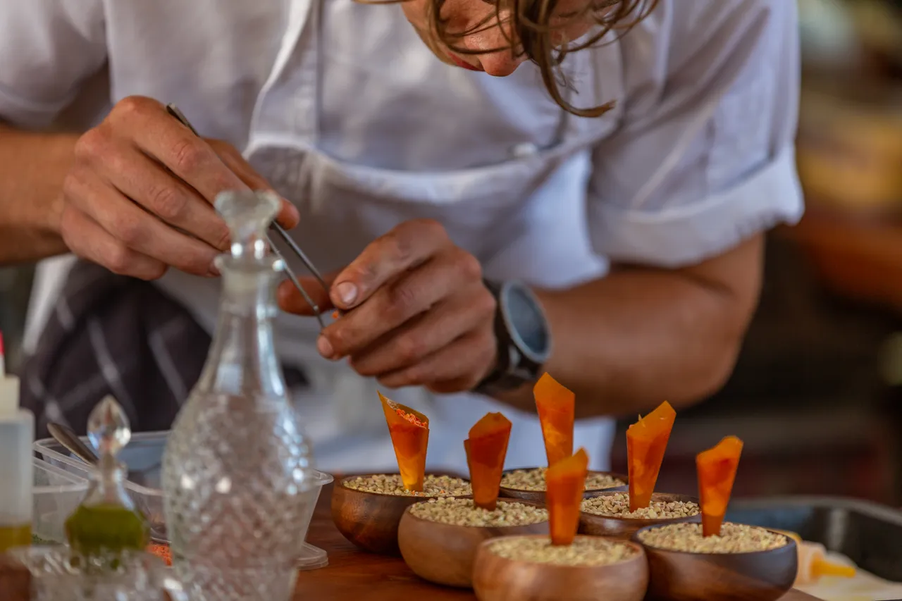 Jack from The Chef's Table putting the final touches on a dish