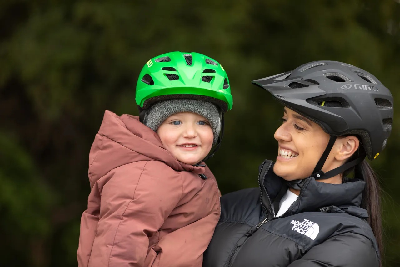 Mother and son laughing after bike riding