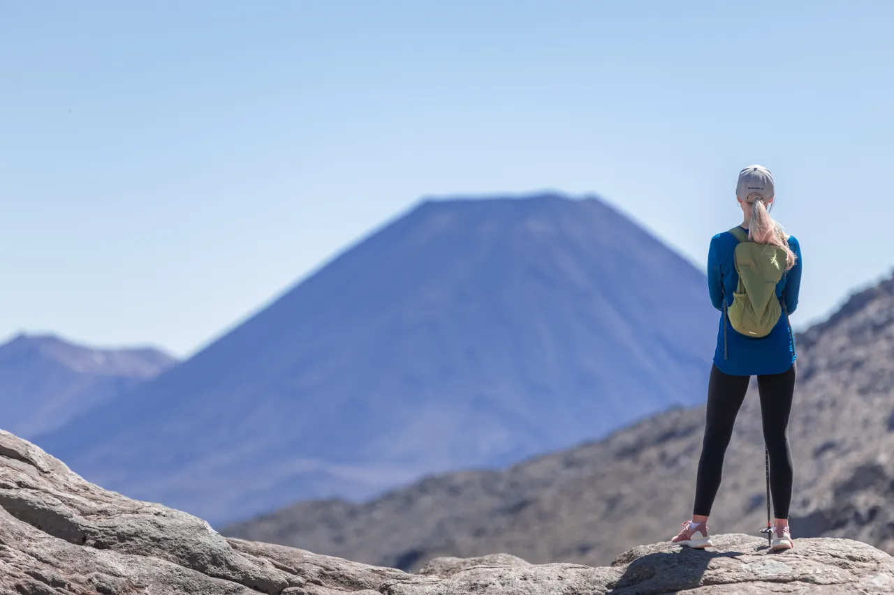 Woman staring across the Tongariro National Park looking at Mt Ngauruhoe