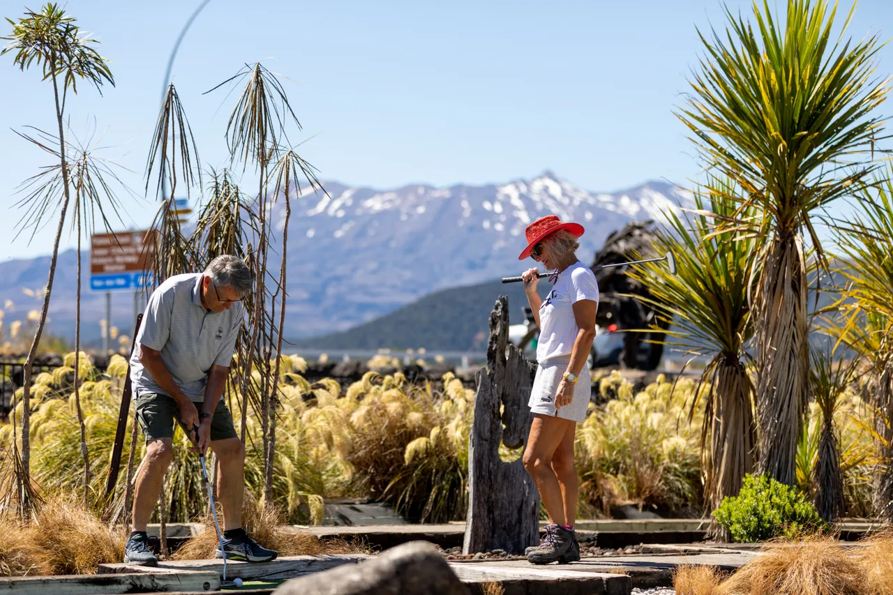 Couple Playing MiniGolf at Schnapps in National Park