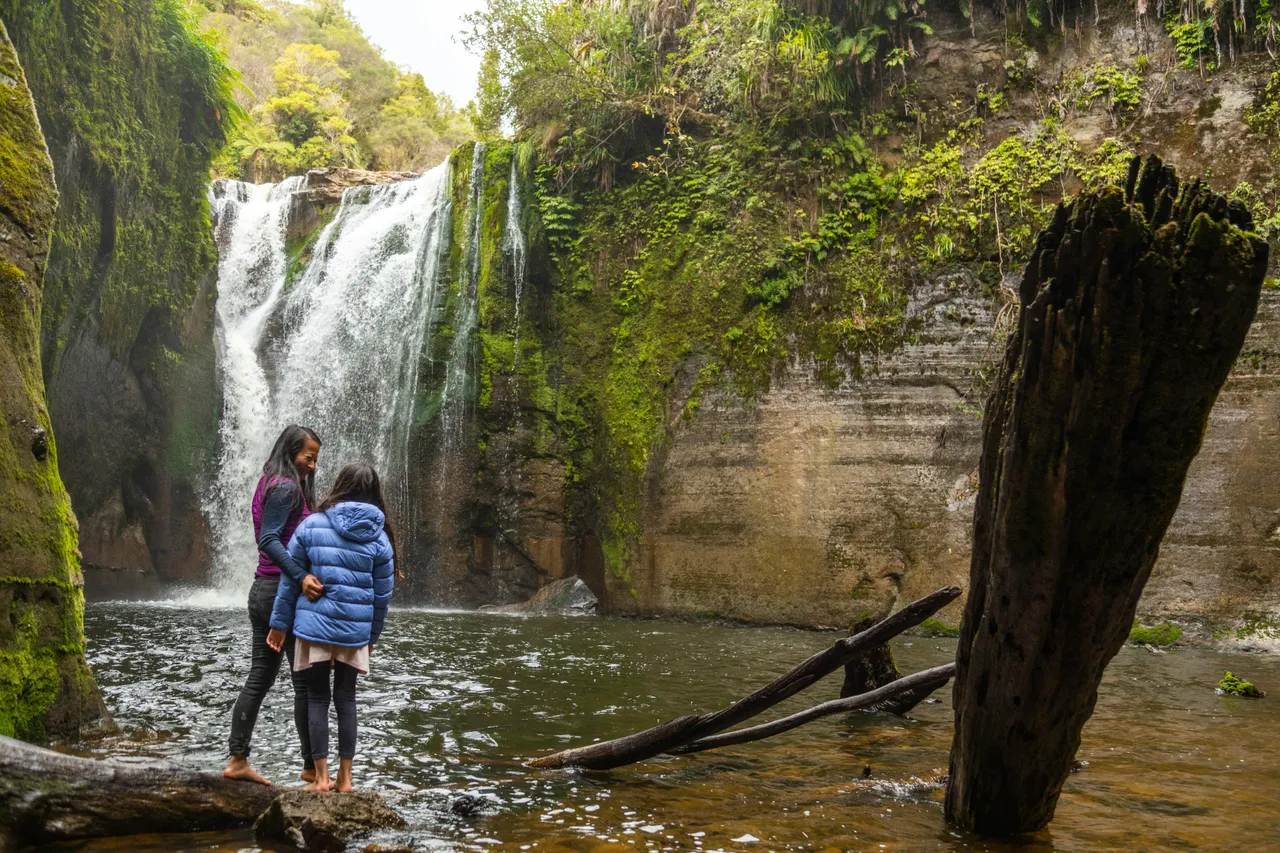 Mother and Daughter Enjoying the Blue Duck Station Waterfalls