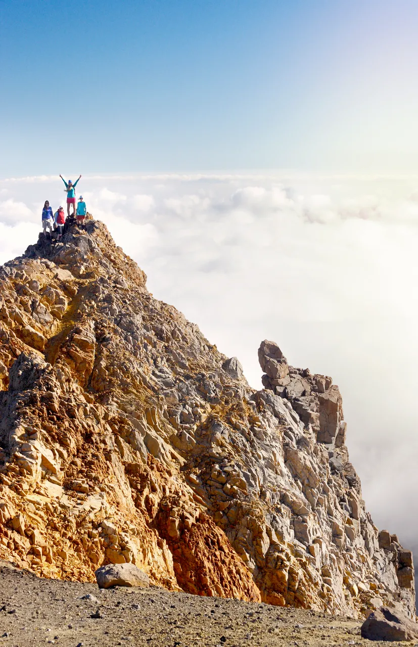 Hikers looking over the skyline on Mt Ruapehu