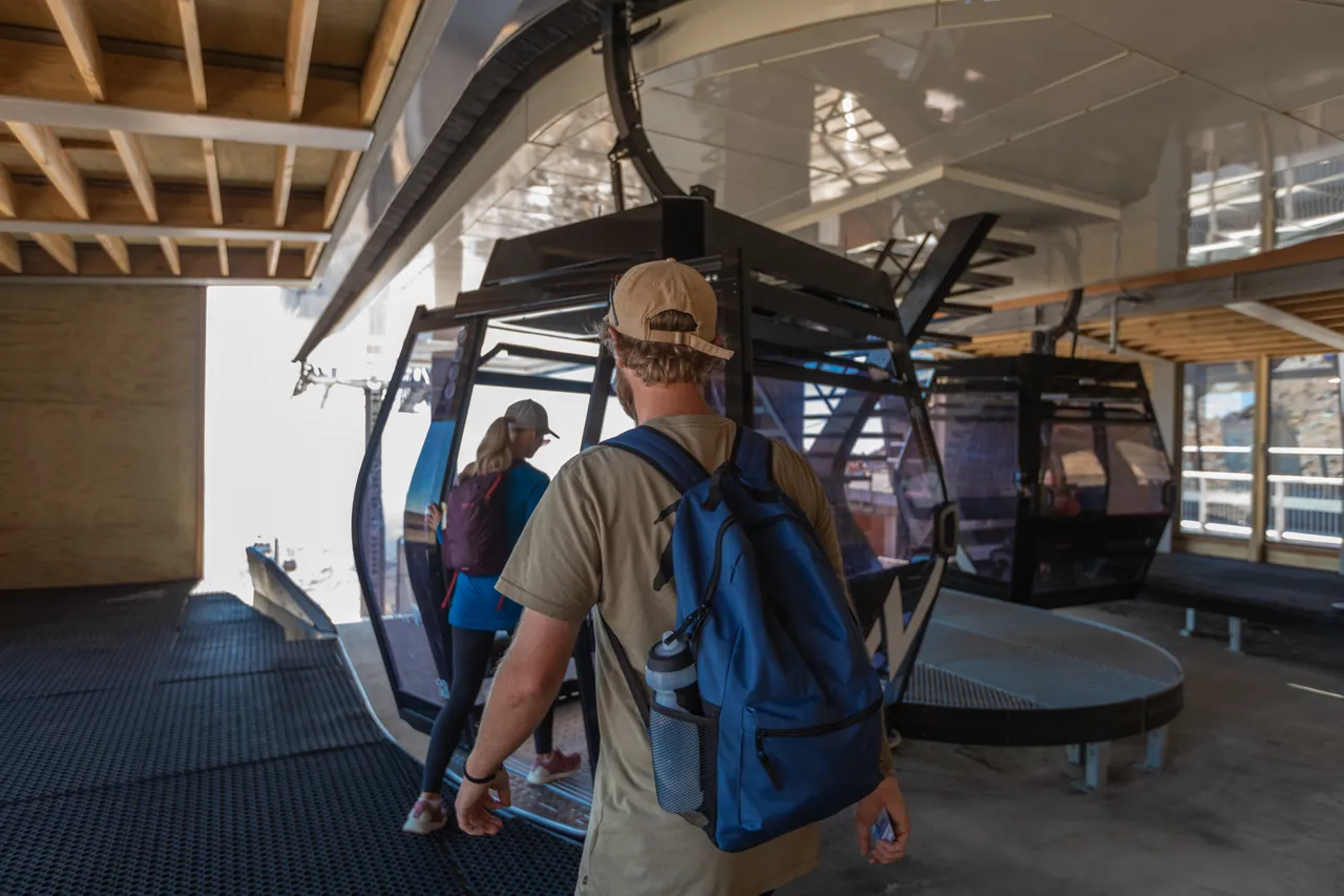 Couple getting on the Sky Waka Gondola at Whakapap Skifield