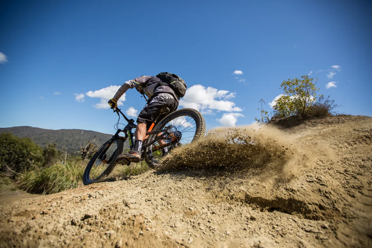 Mountain Biker Skidding on the T42 Track - Visit Ruapehu
