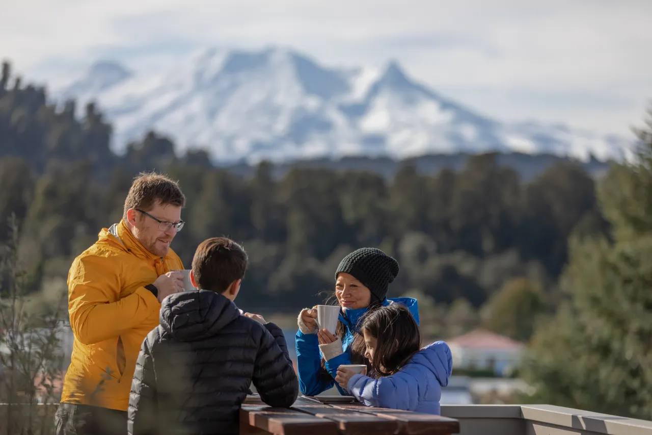 Family enjoying a hot drink on the deck oF Kings