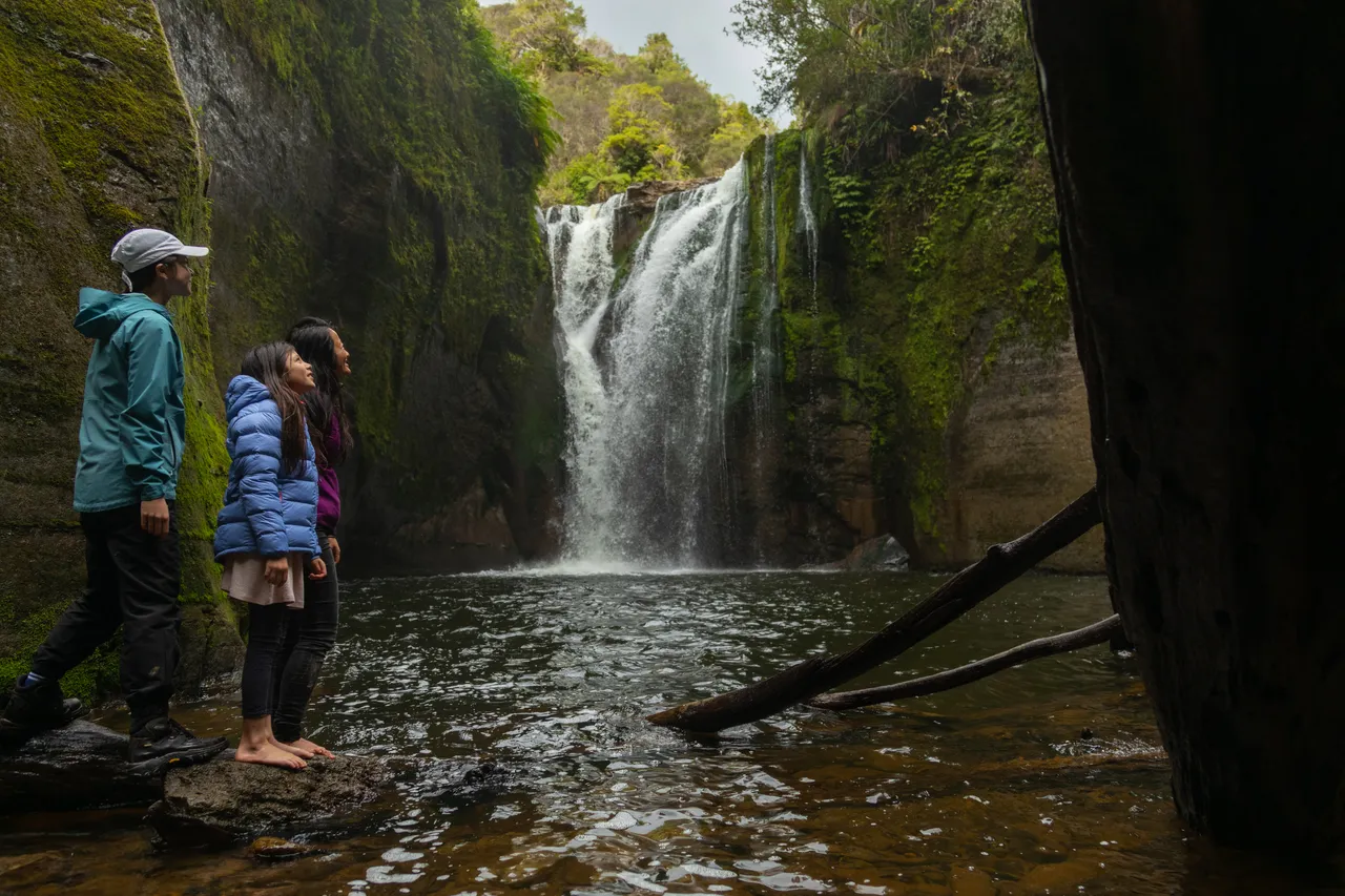 Family at the waterfall on Blue Duck Station
