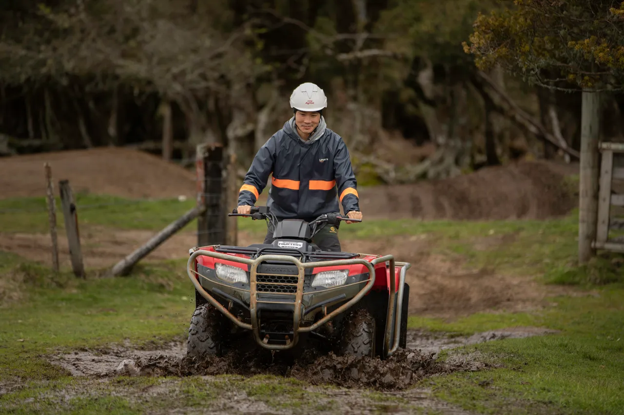 Driving through mud on quad bikes