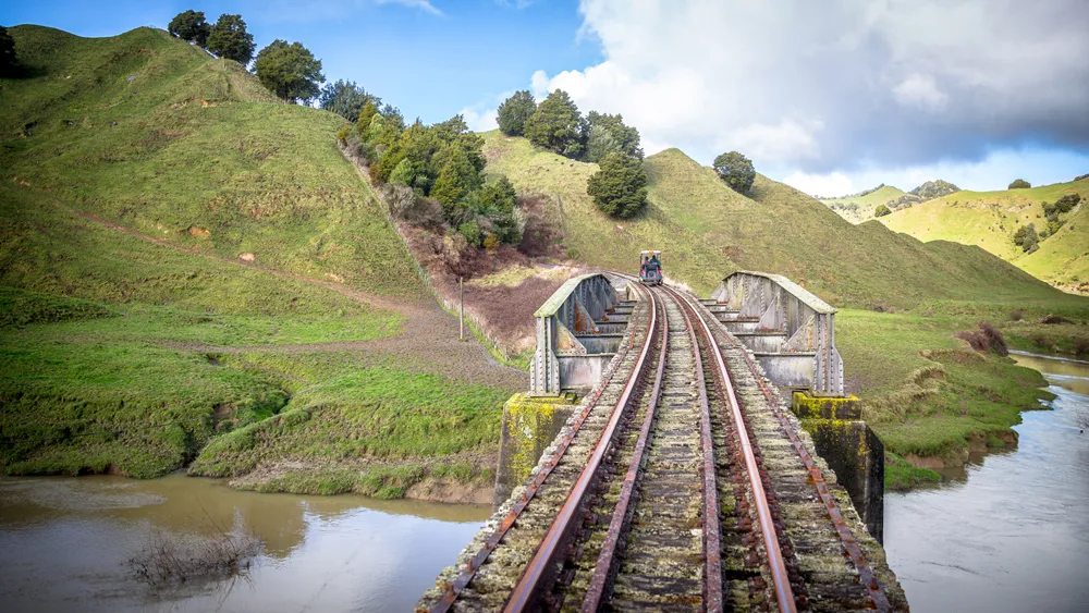 Forgotten World Adventures Rail Cart Crossing a Bridge