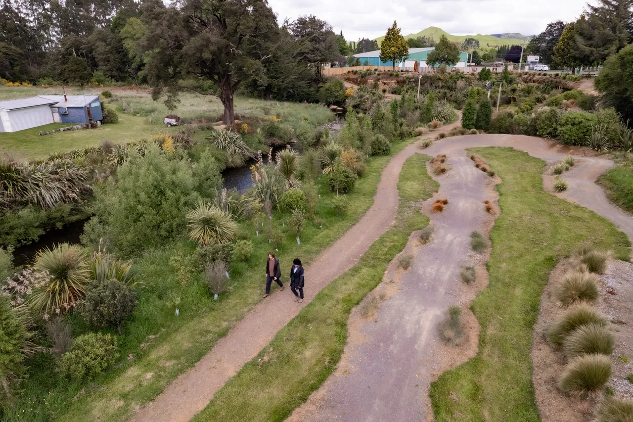 Couple Walking Along the Mākōtuku River Walkway