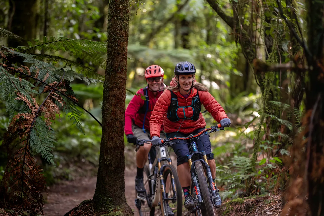 Couple Cycling along the Timber Trail