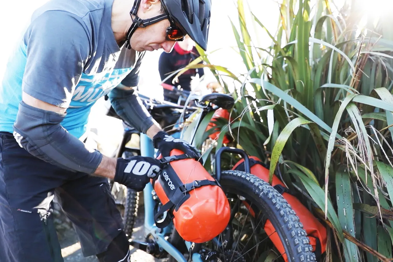 Attaching-orange-bags-to-cradles