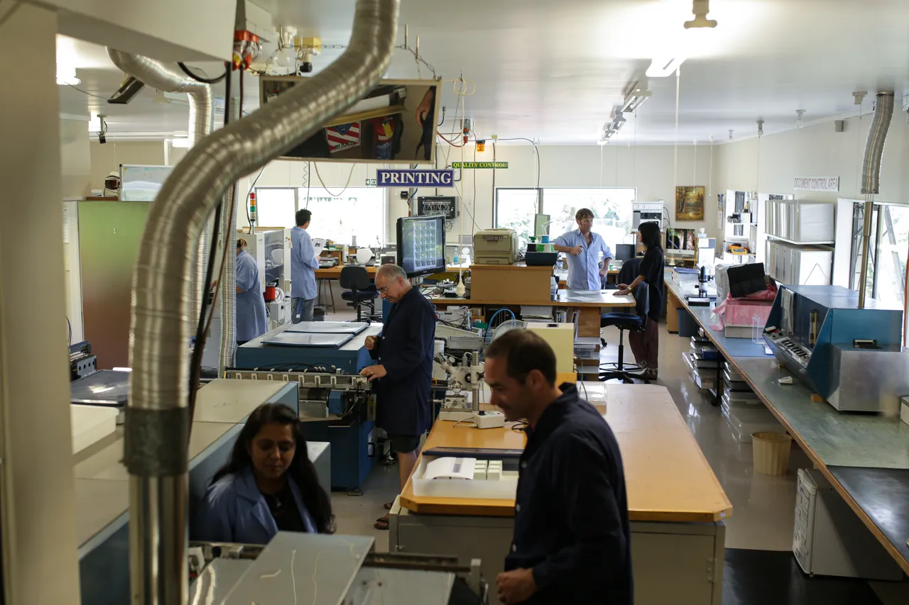 Precision Microcircuits team working on design plans