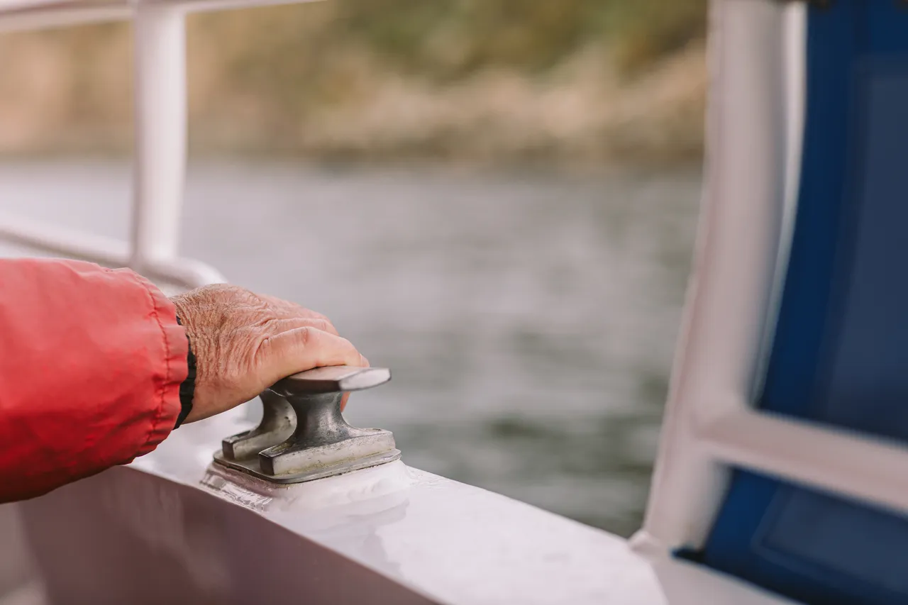 Hand Holding Boat