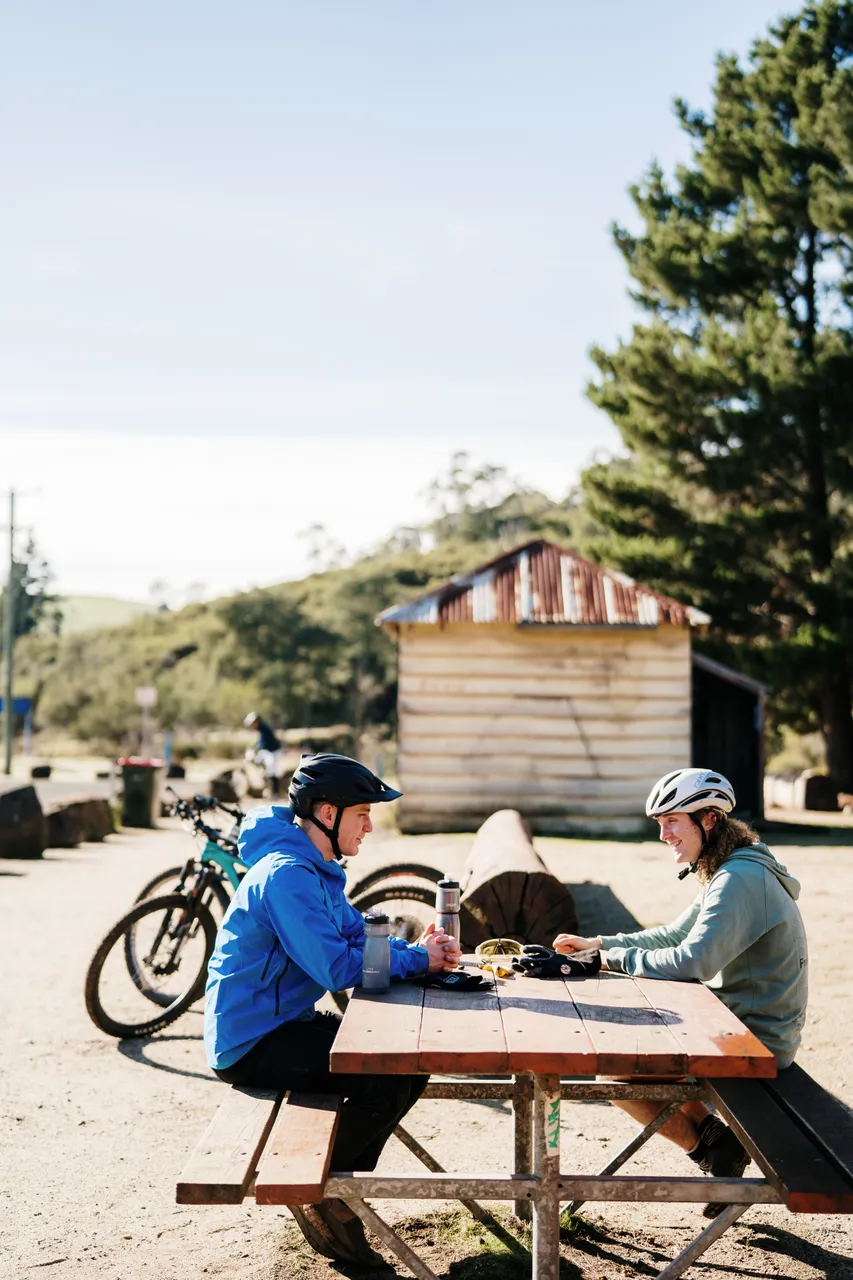 Mountain Bikers Sitting at Table