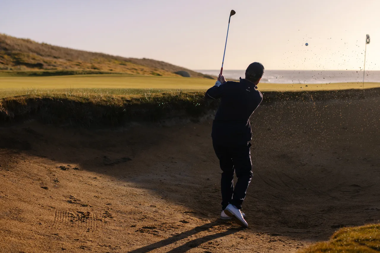 Golfer Chipping from Bunker