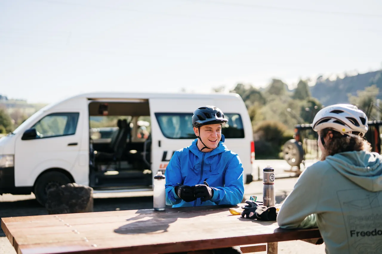 Mountain Bikers Sitting at Table