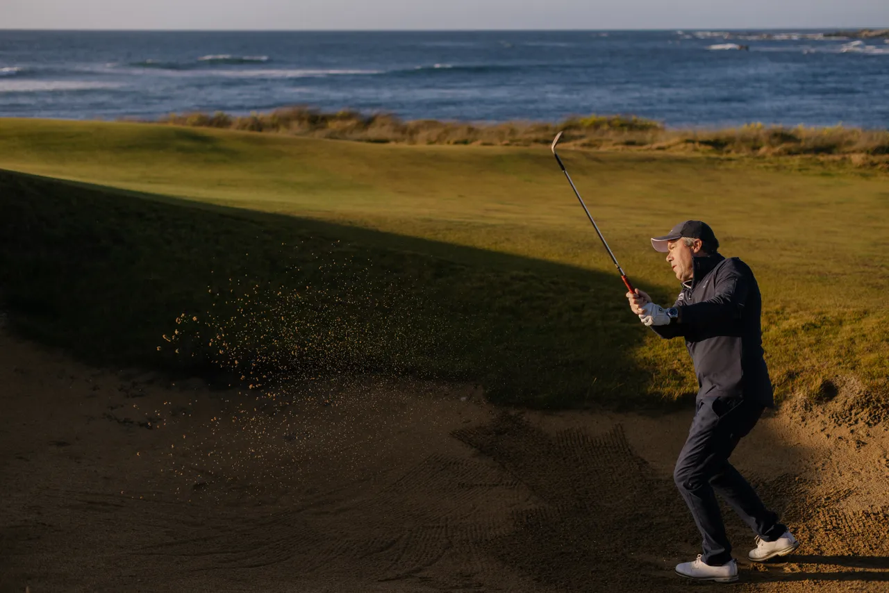 Golfer Chipping from Bunker