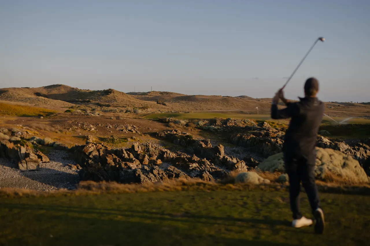 Golfer Teeing Off