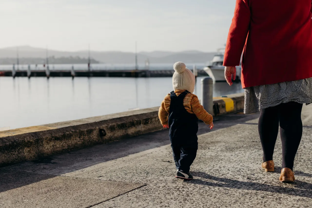 Woman and Child Walking Along the Hobart Waterfront