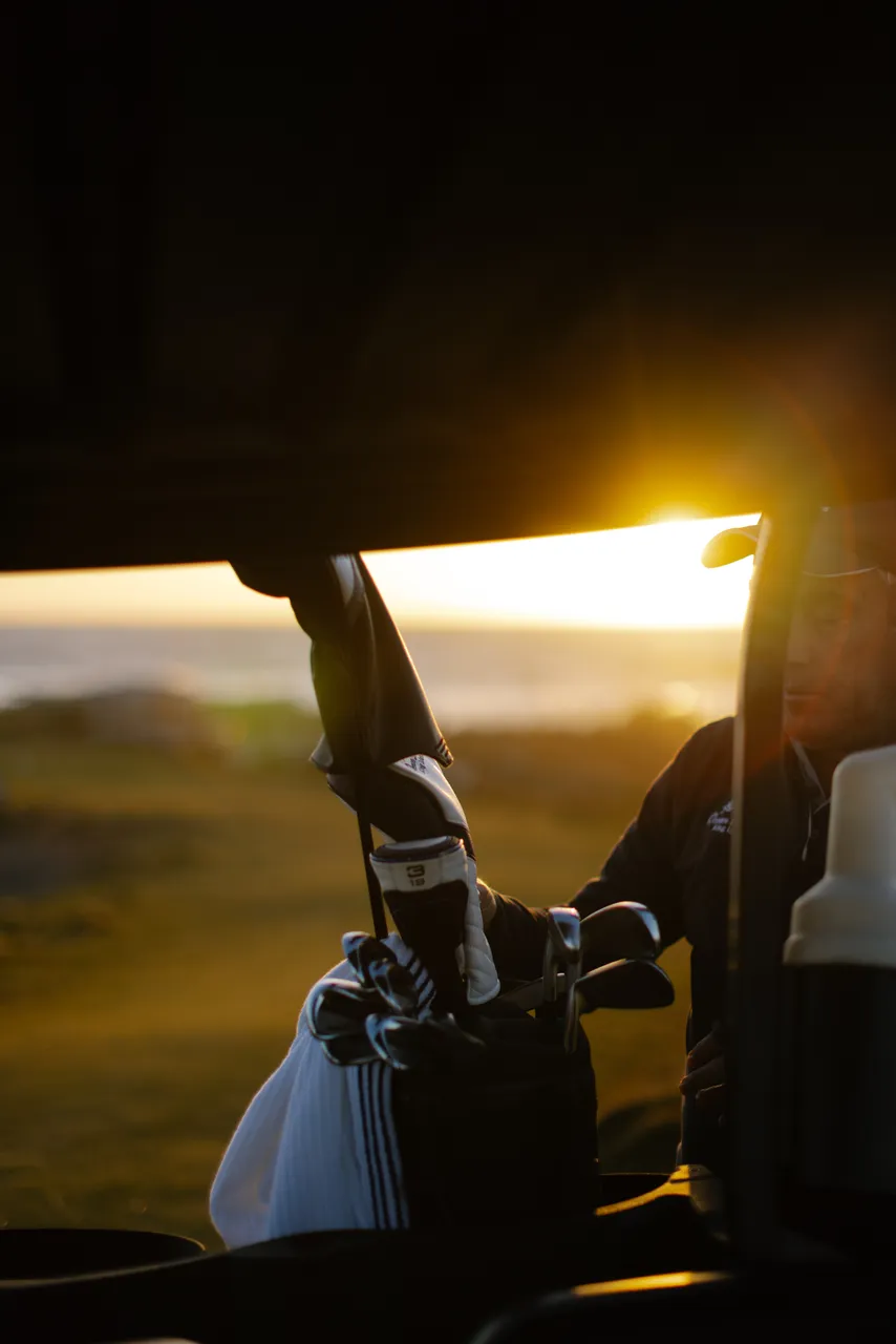 Golfer Sorting Clubs