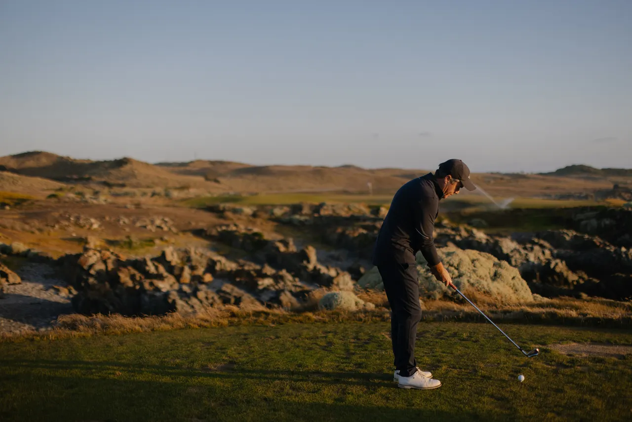 Golfer Teeing Off