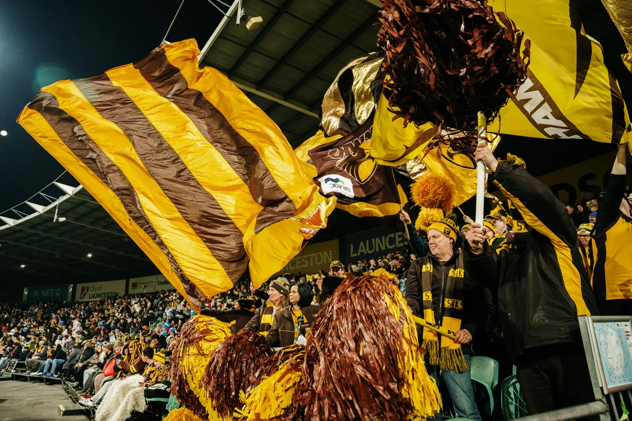 Waving Hawks Flags at UTAS Stadium