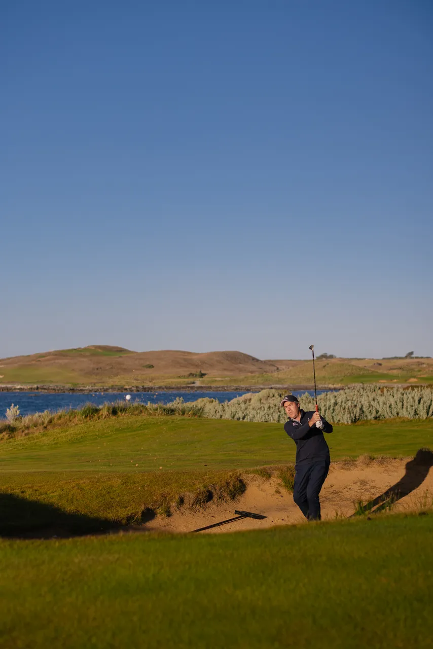 Golfer Chipping from Bunker