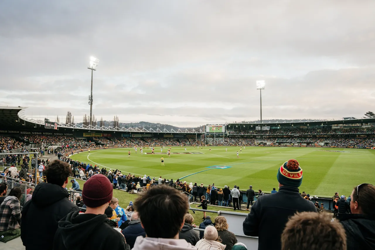 Spectators Watching Football at UTAS Stadium