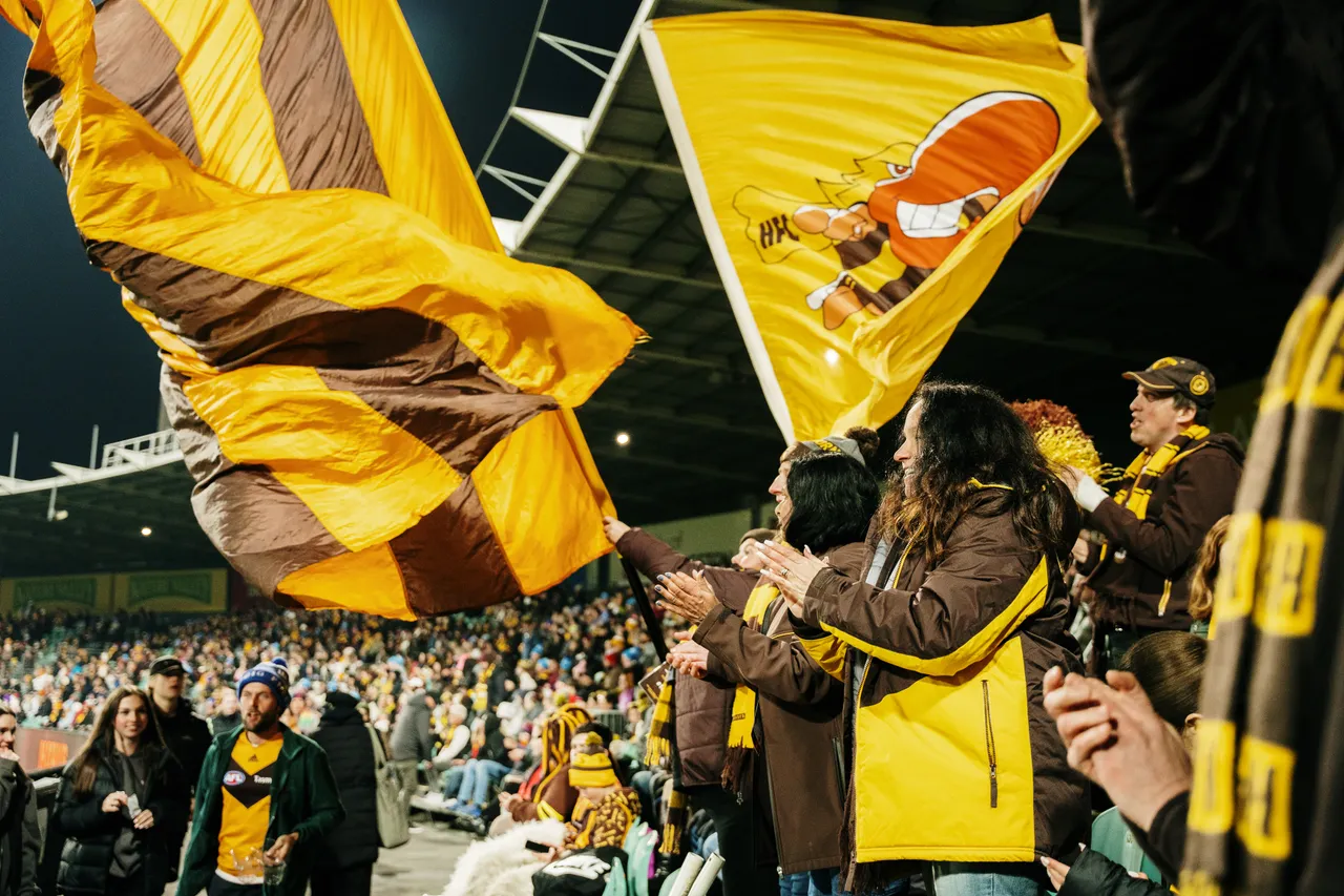 Waving Hawks Flags at UTAS Stadium
