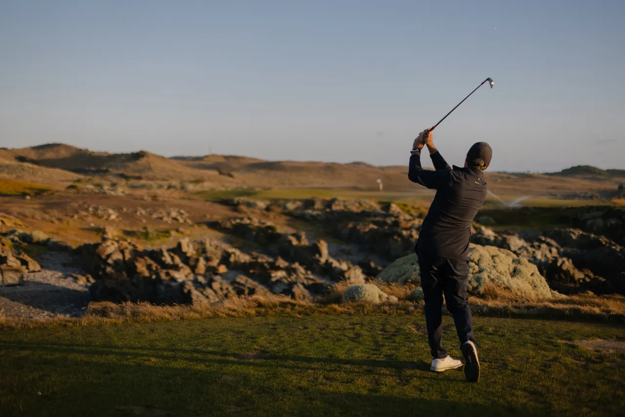 Golfer Teeing Off