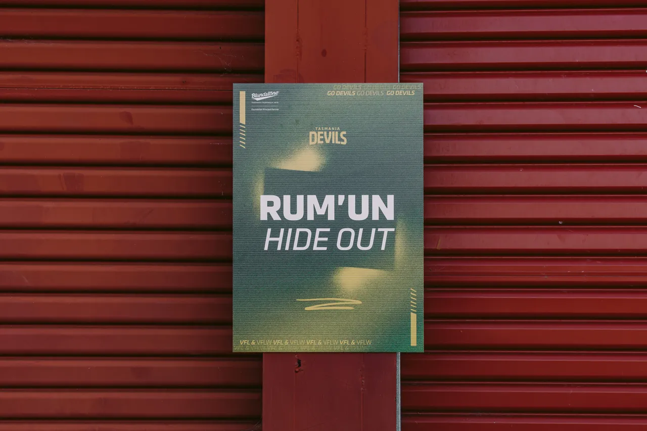 Rum'un Hide Out Sign
