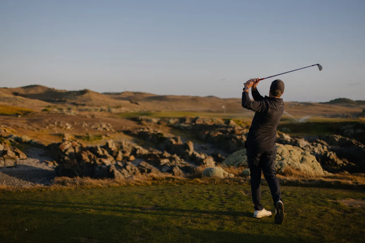 Golfer Teeing Off