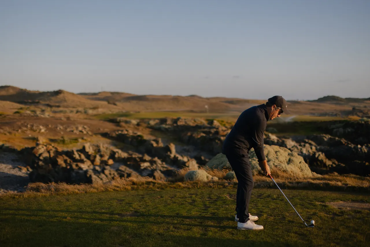 Golfer Teeing Off