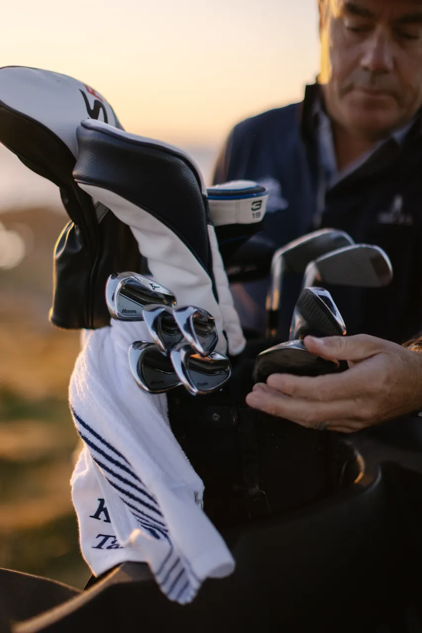 Golfer Sorting Clubs