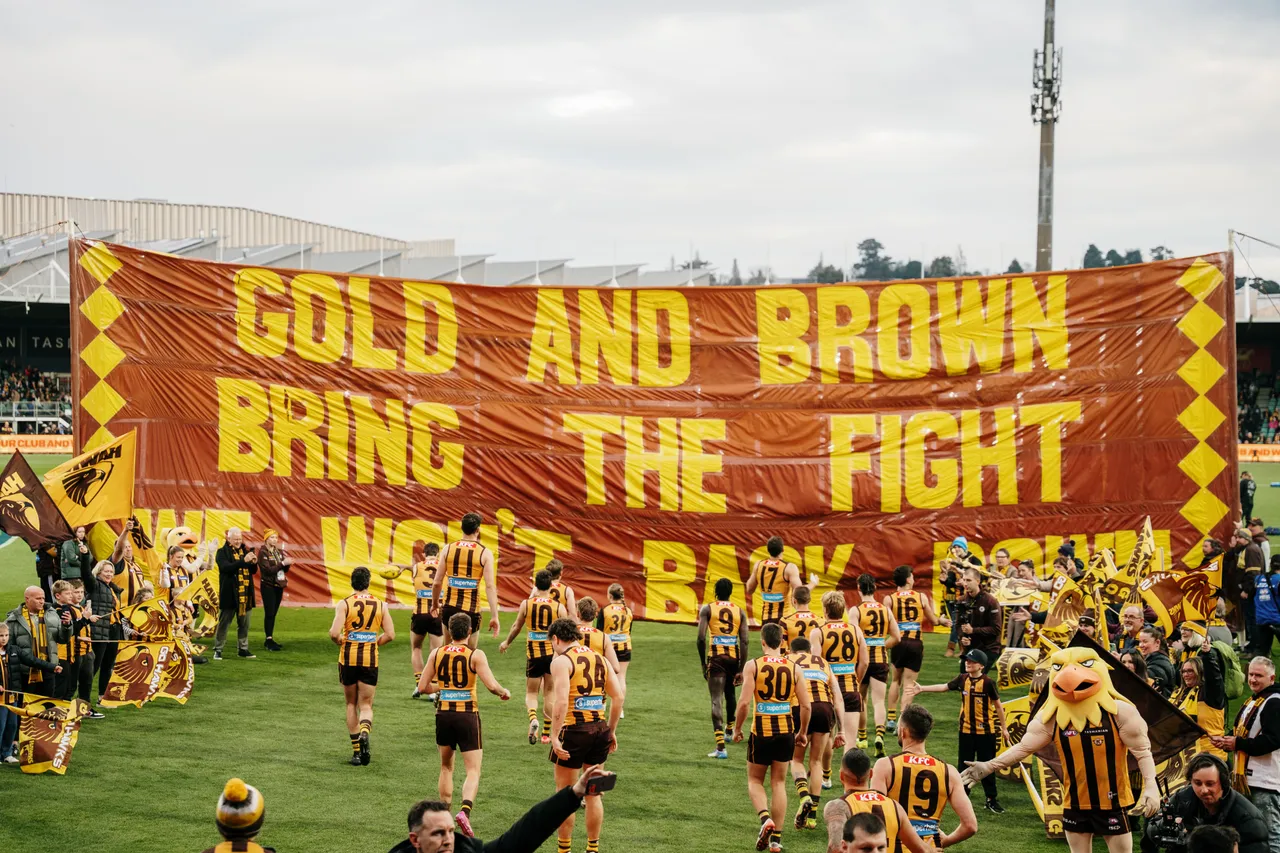 Running Through Banner at UTAS Stadium