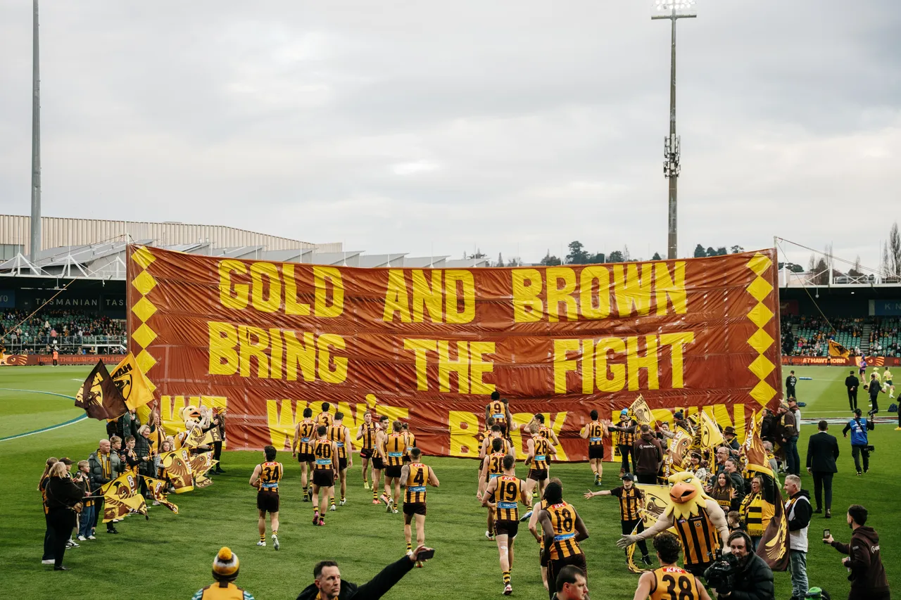 Running Through Banner at UTAS Stadium