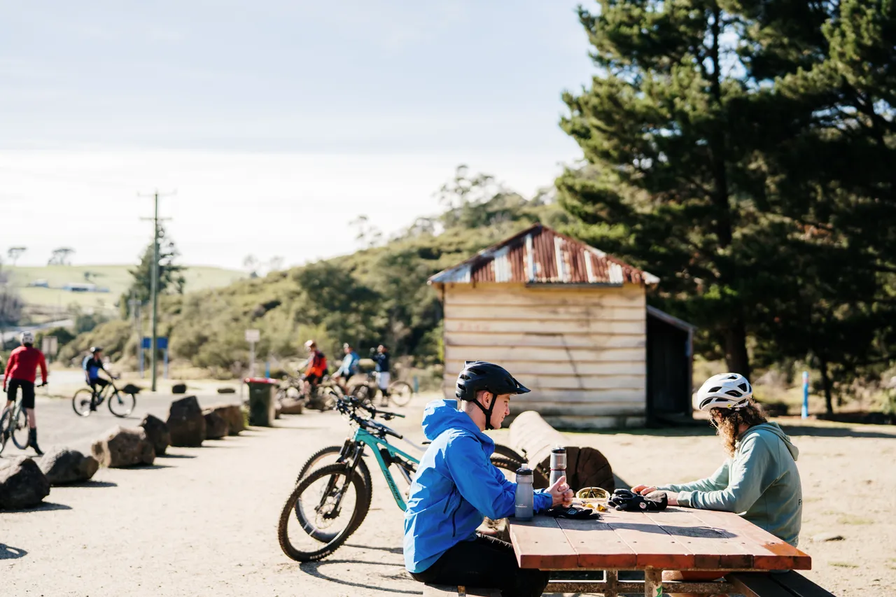 Mountain Bikers Sitting at Table
