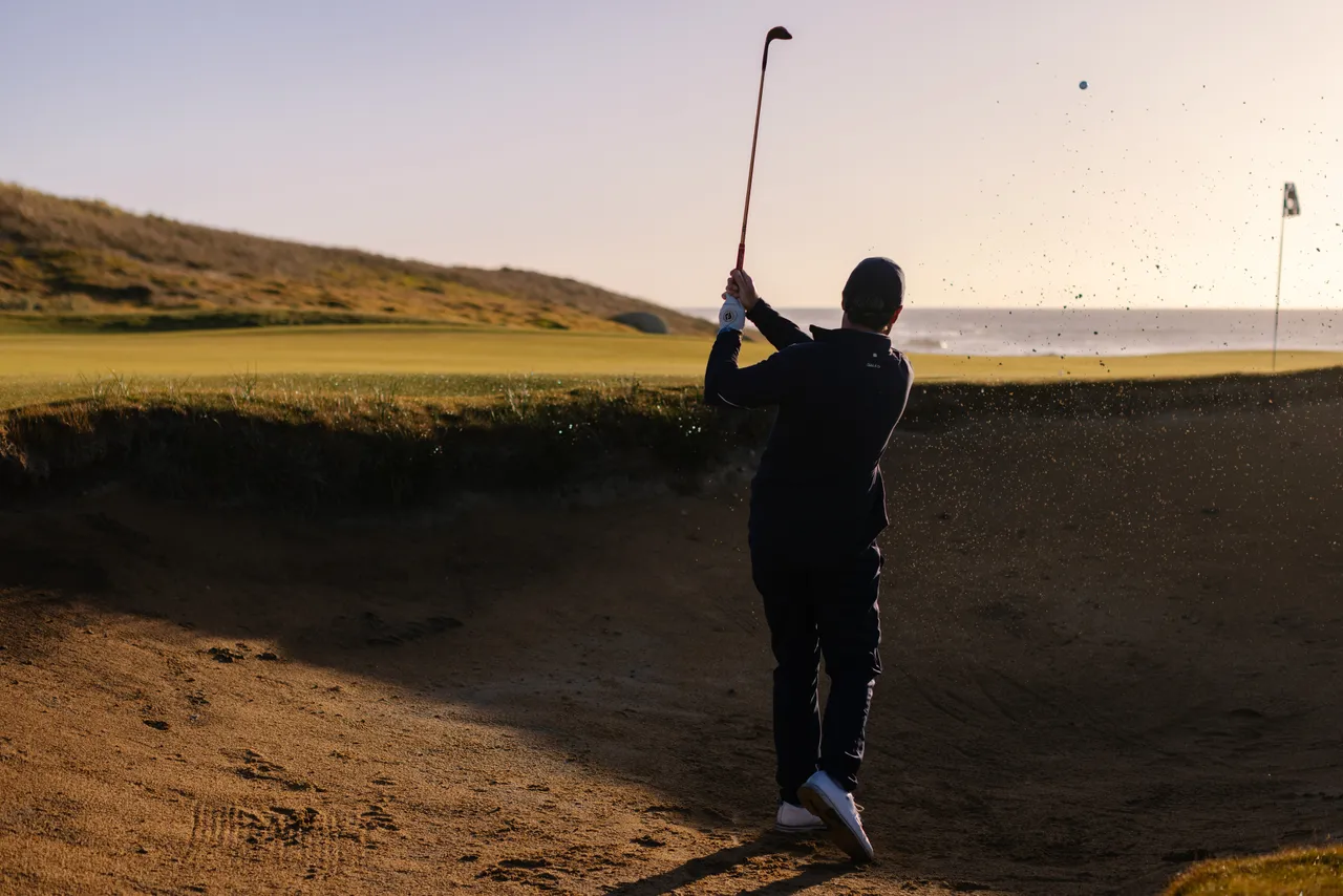 Golfer Chipping from Bunker