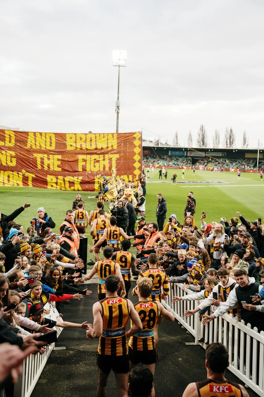 Running Through Banner at UTAS Stadium