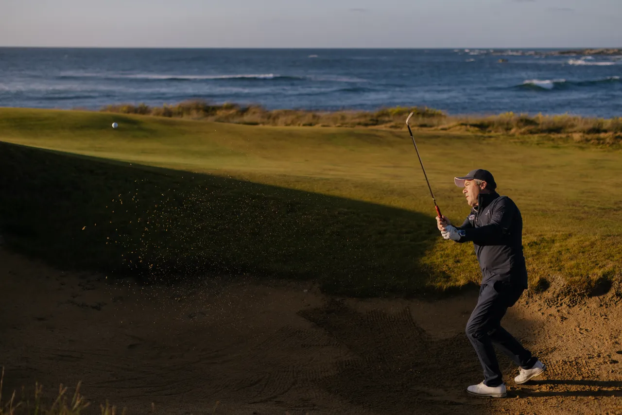Golfer Chipping from Bunker
