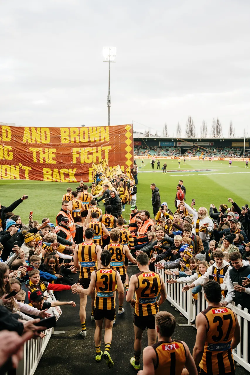 Running Through Banner at UTAS Stadium